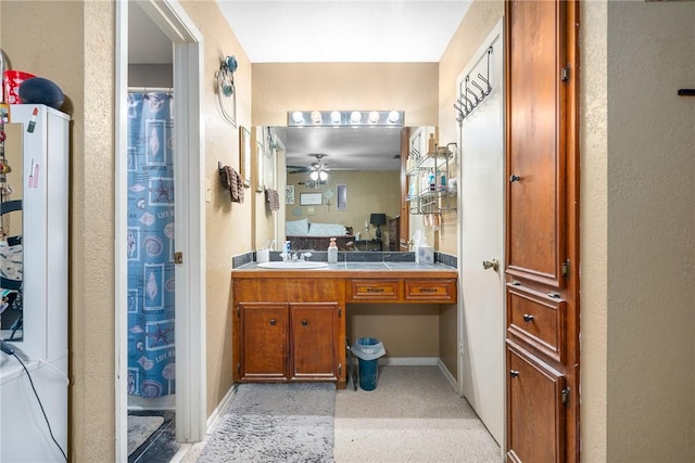 3713 Tripoli Dr, Corpus Christi, TX 78415 - full bath with ceiling fan, vanity, and a textured wall