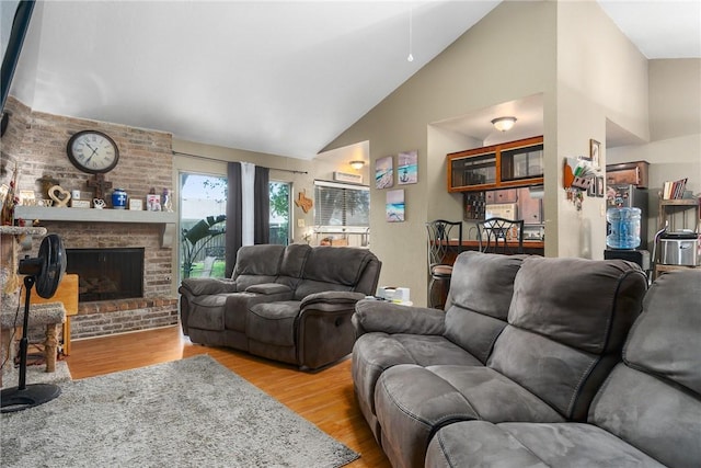 3713 Tripoli Dr, Corpus Christi, TX 78415 - living room with high vaulted ceiling, wood finished floors, and a fireplace