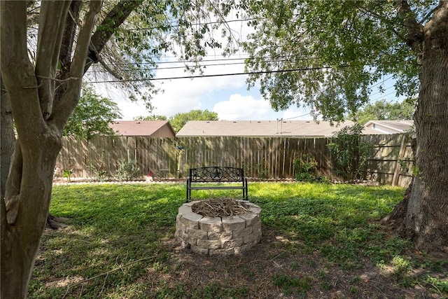 3713 Tripoli Dr, Corpus Christi, TX 78415 - fenced backyard featuring an outdoor fire pit
