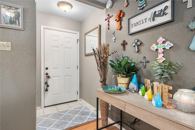 3713 Tripoli Dr, Corpus Christi, TX 78415 - entryway with light tile patterned flooring and baseboards