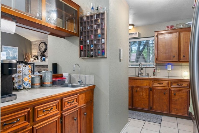 3713 Tripoli Dr, Corpus Christi, TX 78415 - bar area with a textured wall, light tile patterned floors, freestanding refrigerator, and backsplash