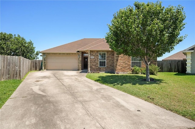 3601 Amethyst Dr, Corpus Christi, TX 78414 - view of front of home with an attached garage, driveway, and brick siding