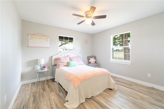 bedroom featuring wood-type flooring and ceiling fan