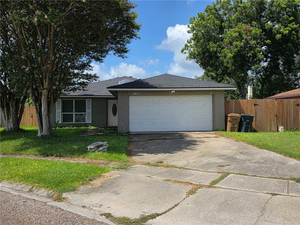 4417 Squaw Pass Ct, Corpus Christi, TX 78413 - single story home with brick siding, concrete driveway, an attached garage, and roof with shingles