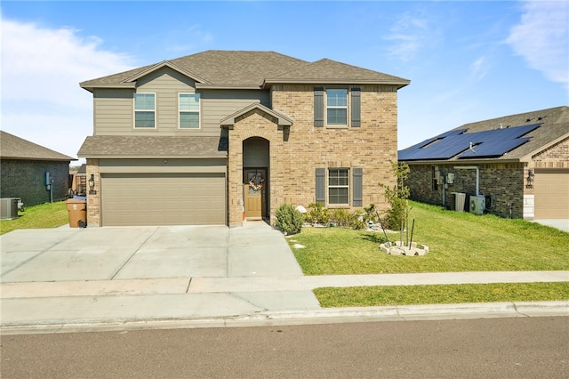 front facade featuring a garage, a front lawn, and cooling unit