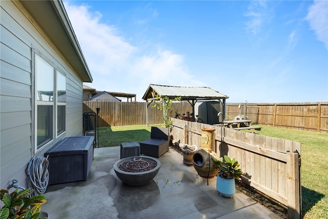 view of patio featuring a gazebo and an outdoor fire pit