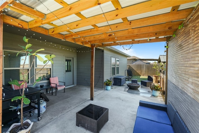 view of patio / terrace with an outdoor fire pit