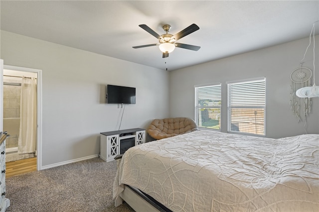 carpeted bedroom with ceiling fan and connected bathroom