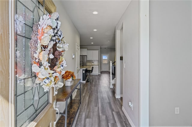 corridor featuring dark hardwood / wood-style floors