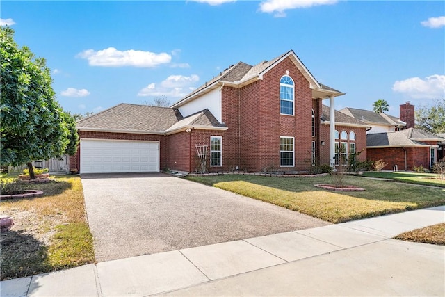 view of property featuring a garage and a front yard