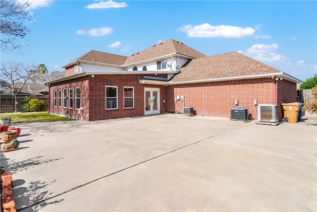 back of property featuring a patio, central AC, and french doors