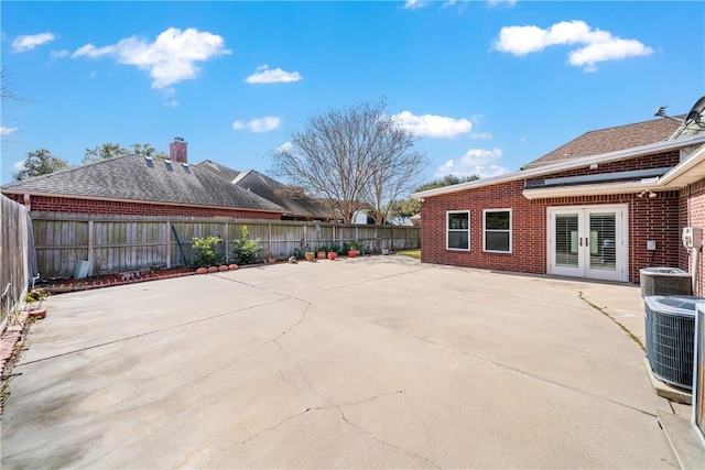 view of patio with french doors and central air condition unit