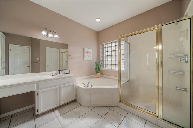 bathroom with vanity, tile patterned flooring, and shower with separate bathtub