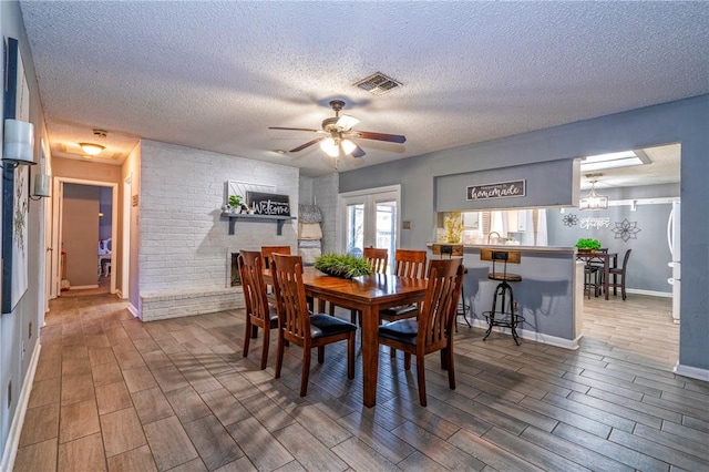 4318 Pecan Bayou Ct, Corpus Christi, TX 78410 - dining space featuring ceiling fan with notable chandelier and a textured ceiling