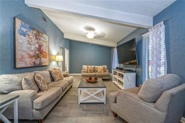 4318 Pecan Bayou Ct, Corpus Christi, TX 78410 - living room with lofted ceiling with beams and a textured ceiling