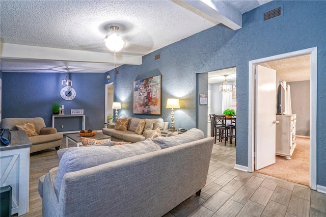 4318 Pecan Bayou Ct, Corpus Christi, TX 78410 - living room with lofted ceiling with beams and a textured ceiling