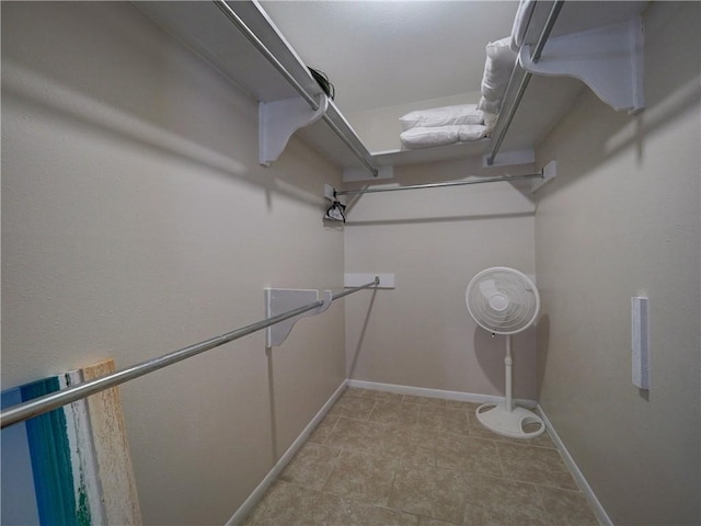 walk in closet featuring light tile patterned floors