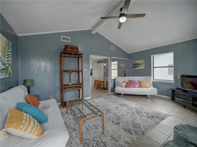 living room with a ceiling fan, tile patterned flooring, and crown molding