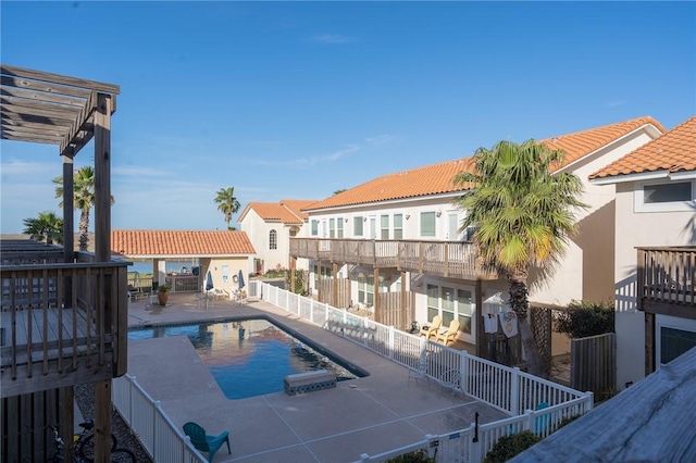 14878 Granada Dr Unit 403, Corpus Christi, TX 78418 - view of swimming pool with a fenced in pool, a patio area, and fence