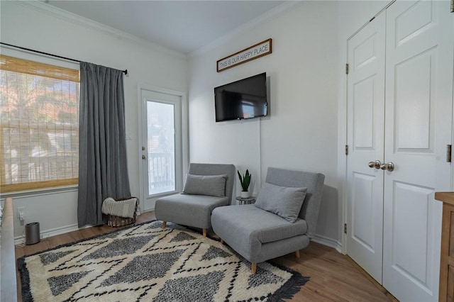 14878 Granada Dr Unit 403, Corpus Christi, TX 78418 - sitting room featuring wood finished floors, baseboards, and ornamental molding