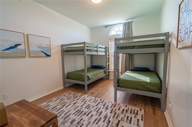 14878 Granada Dr Unit 403, Corpus Christi, TX 78418 - bedroom featuring baseboards and wood finished floors