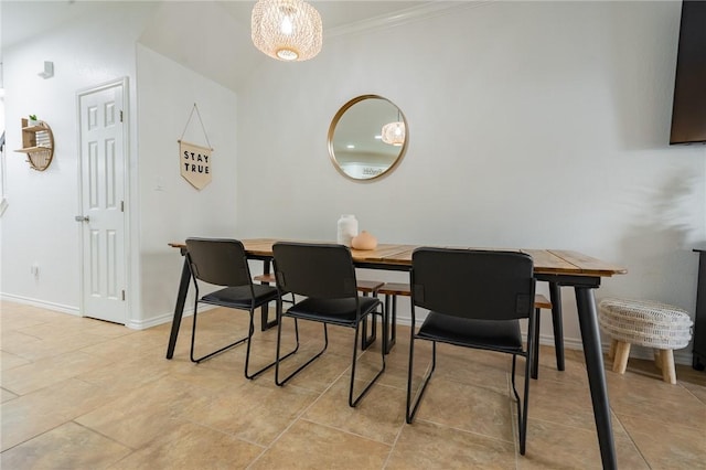 14878 Granada Dr Unit 403, Corpus Christi, TX 78418 - dining area with crown molding, baseboards, and light tile patterned flooring