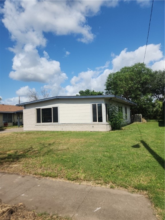 view of home's exterior featuring a yard