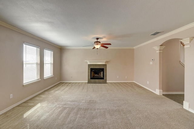 2334 Mystic Star Dr, Corpus Christi, TX 78414 - unfurnished living room with ornate columns, carpet, ceiling fan, a tile fireplace, and ornamental molding