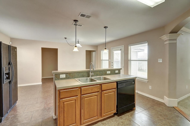 2334 Mystic Star Dr, Corpus Christi, TX 78414 - kitchen featuring black appliances, arched walkways, light countertops, and pendant lighting
