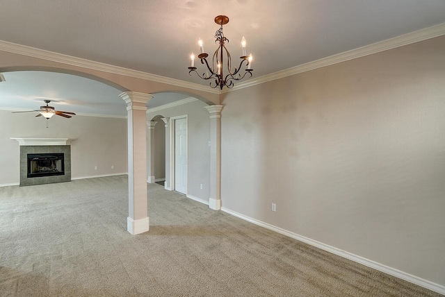 2334 Mystic Star Dr, Corpus Christi, TX 78414 - unfurnished living room with ceiling fan, ornate columns, light colored carpet, a tiled fireplace, and arched walkways
