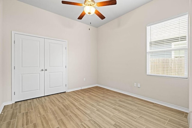 unfurnished bedroom with a closet and ceiling fan