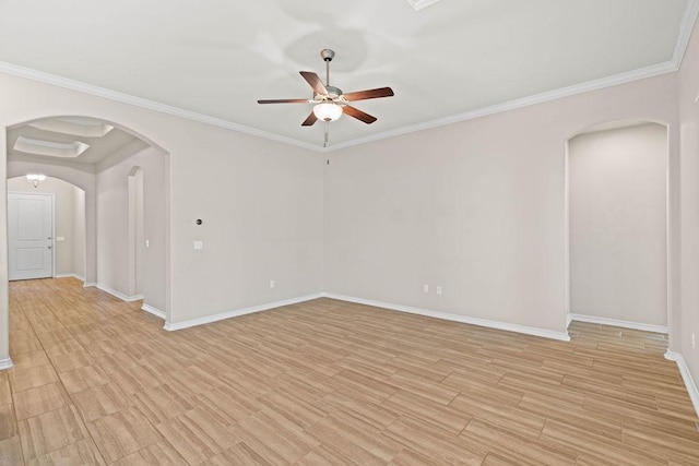 spare room featuring ceiling fan, light hardwood / wood-style floors, and crown molding