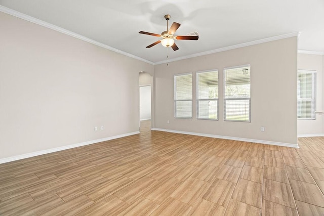 empty room featuring ornamental molding and ceiling fan