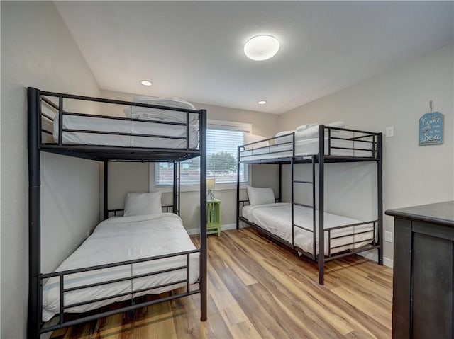 230 Cut Off Rd Unit 129, Port Aransas, TX 78373 - bedroom with wood finished floors, baseboards, and recessed lighting