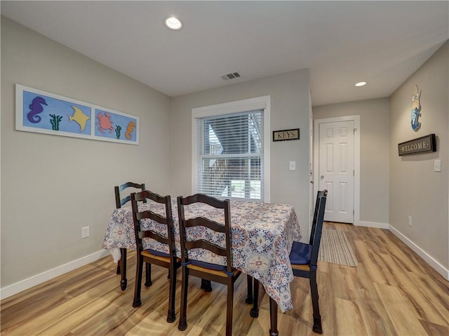230 Cut Off Rd Unit 129, Port Aransas, TX 78373 - dining space featuring baseboards, light wood-type flooring, and recessed lighting