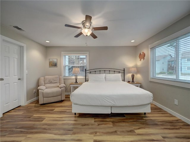 230 Cut Off Rd Unit 129, Port Aransas, TX 78373 - bedroom featuring wood finished floors, baseboards, recessed lighting, and ceiling fan