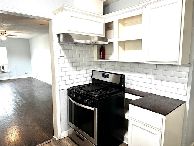 kitchen featuring gas range, white cabinetry, wall chimney exhaust hood, tasteful backsplash, and dark hardwood / wood-style floors