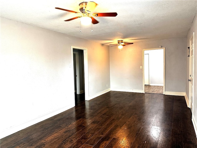 unfurnished room featuring ceiling fan, dark hardwood / wood-style flooring, and a textured ceiling