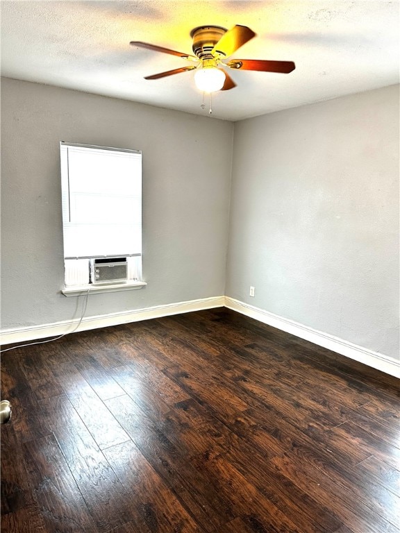 unfurnished room with dark hardwood / wood-style floors, ceiling fan, and cooling unit