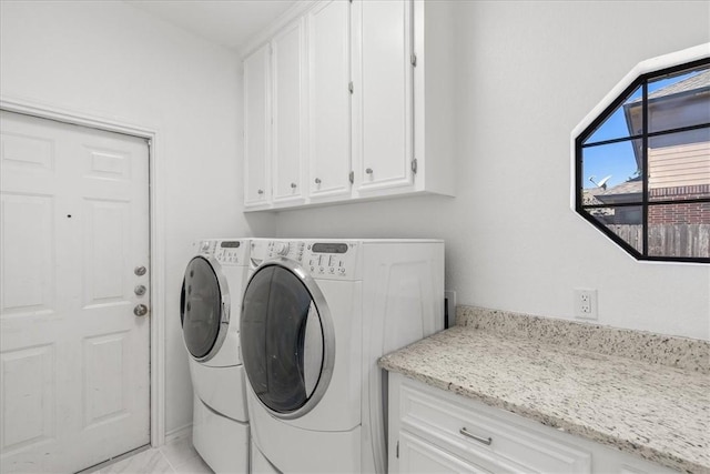 5913 Woodmere Dr, Corpus Christi, TX 78414 - laundry area featuring separate washer and dryer and cabinet space