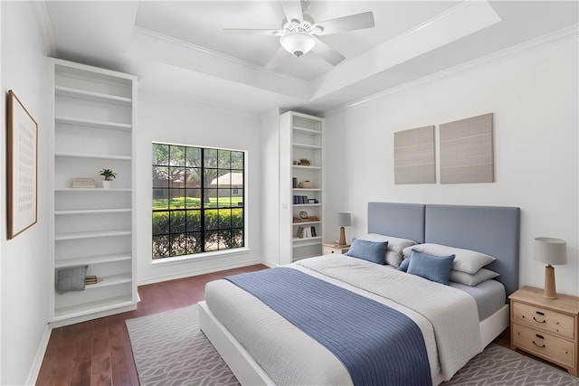 5913 Woodmere Dr, Corpus Christi, TX 78414 - bedroom featuring wood finished floors, ornamental molding, a raised ceiling, a ceiling fan, and baseboards