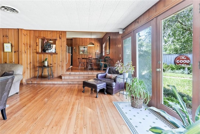 144 Cordula St, Corpus Christi, TX 78411 - living area featuring hardwood / wood-style flooring and wood walls