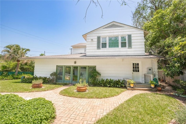 144 Cordula St, Corpus Christi, TX 78411 - back of property with a yard and roof with shingles