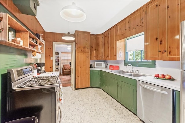 144 Cordula St, Corpus Christi, TX 78411 - kitchen with appliances with stainless steel finishes, green cabinets, a sink, light countertops, and open shelves