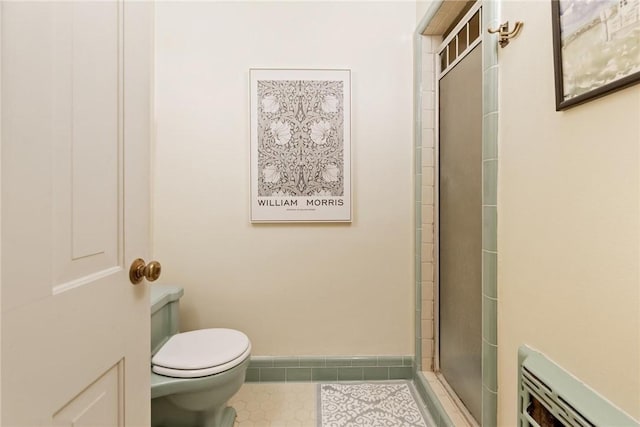 144 Cordula St, Corpus Christi, TX 78411 - bathroom with toilet, tile patterned flooring, and a shower