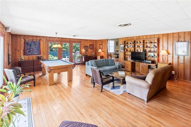 144 Cordula St, Corpus Christi, TX 78411 - living area with wooden walls, pool table, and light wood-type flooring