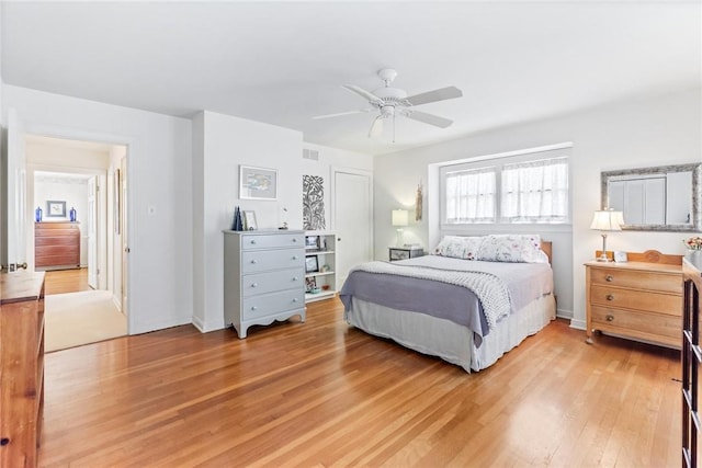 144 Cordula St, Corpus Christi, TX 78411 - bedroom featuring light wood-style flooring, a ceiling fan, and baseboards