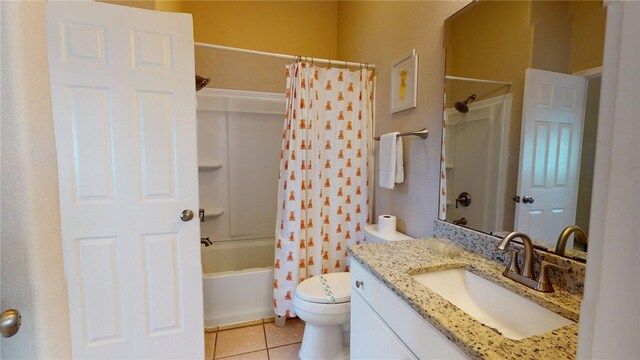 full bathroom featuring vanity, toilet, tile patterned flooring, and shower / tub combo