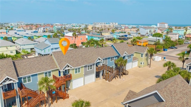 birds eye view of property with a residential view