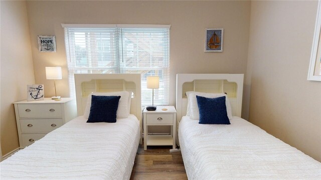 bedroom with wood finished floors